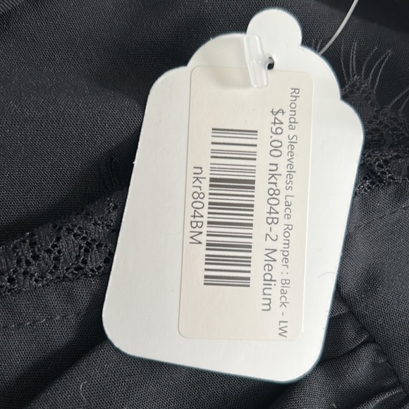 Black pleated front romper with lace trim sleeves and neck line - Picture 5 of 10